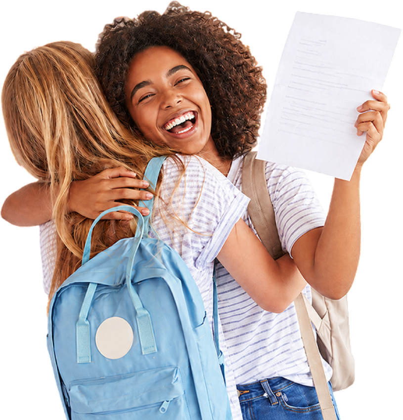Two students embracing, one holding a paper
